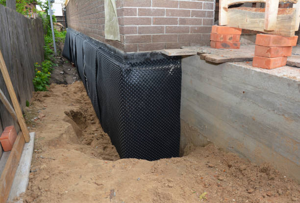 Happy homeowners after waterproofing job in Canaseraga